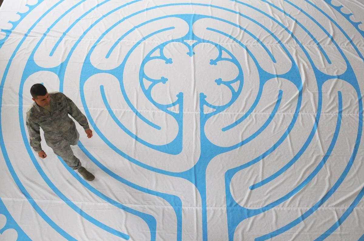 Soldier walks through a meditation labyrinth