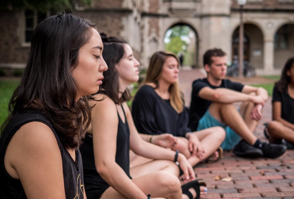 Heather Rice's students meditate in the quad