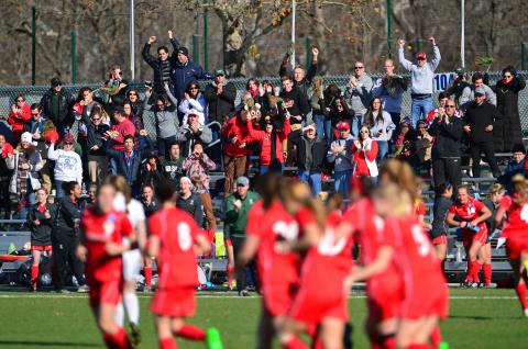 Fans cheer at a Washington University women's soccer game