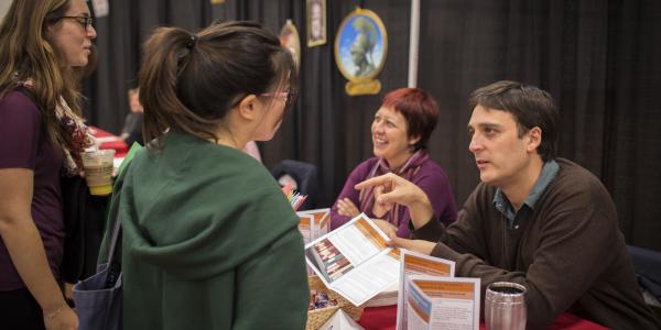 Students and faculty talk at the Major Minor Fair