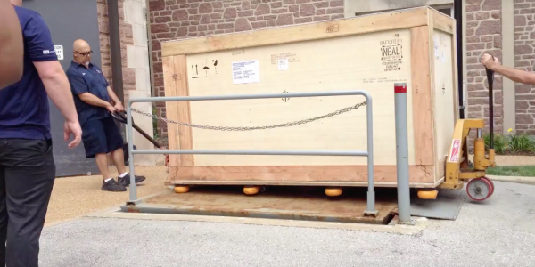 A large crate arrives at WashU